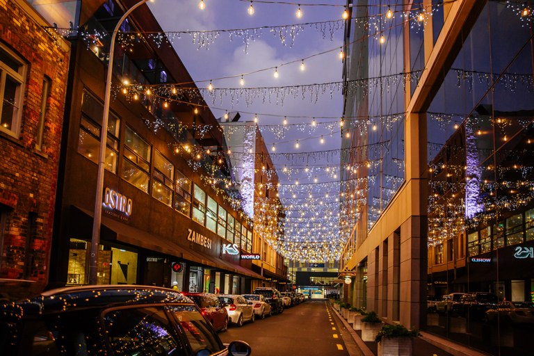 City laneway with lights at twilight