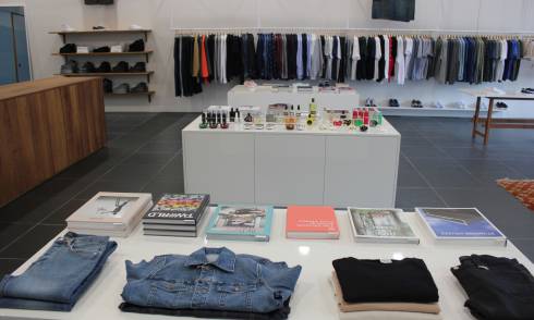 Garments, books and perfume displayed in the store