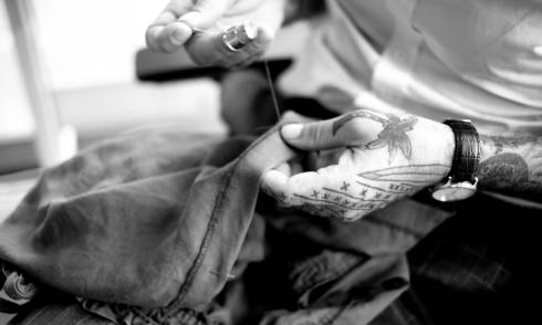 Simon tailoring a garment