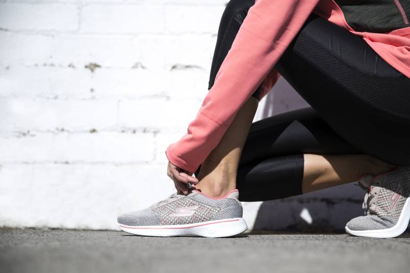 runner adjusting Skechers